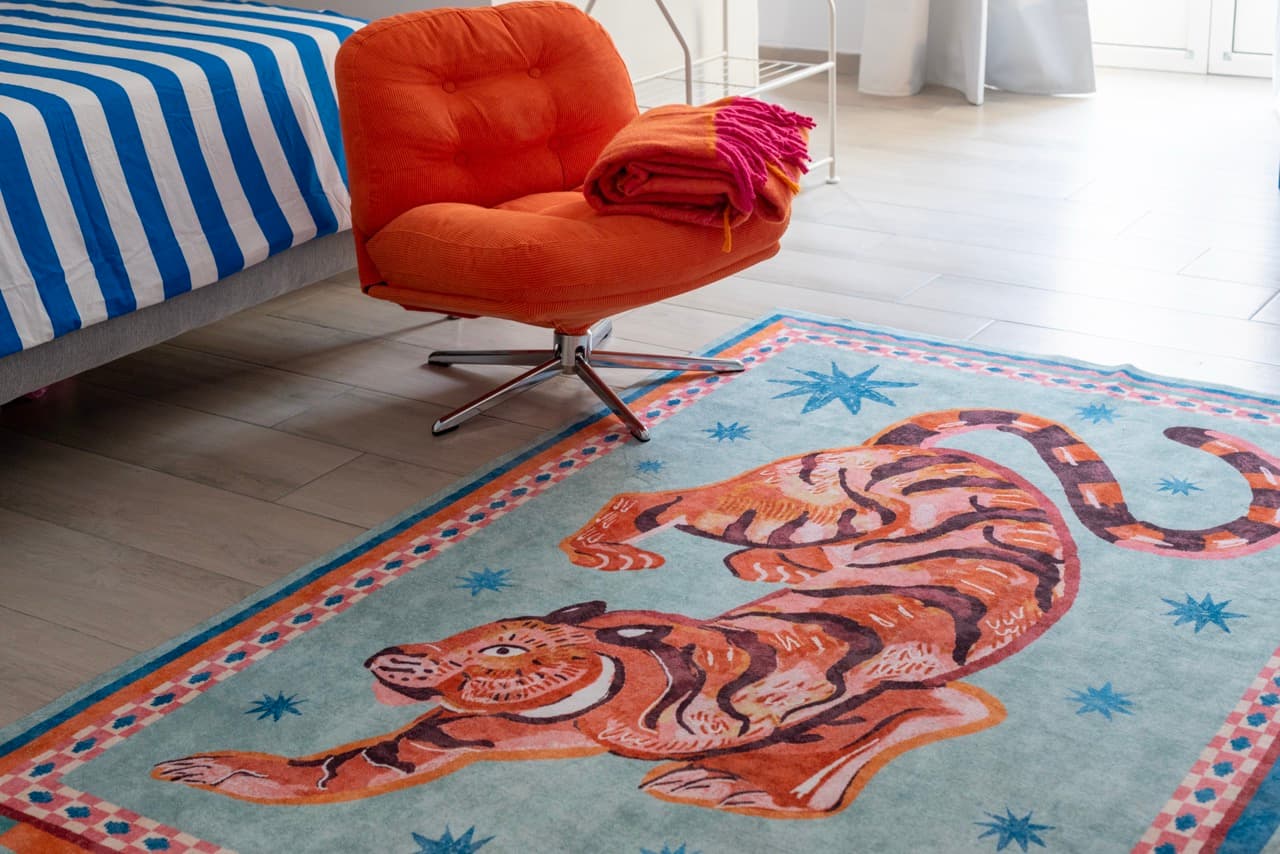 Tiger rug and orange armchair